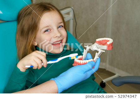 Little girl in dental clinic Little girl in dental clinic 52974347