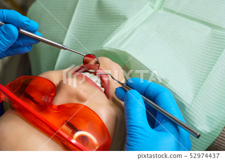 Preventive examination at dentist 52974437