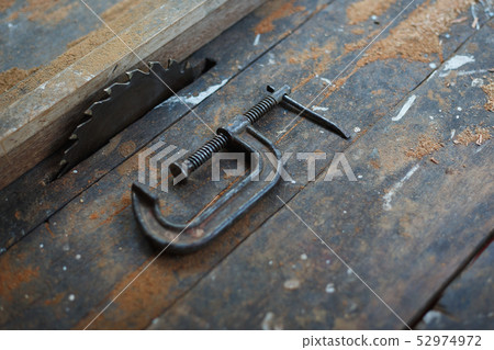 Close up vintage table saw and c clamp Close up vintage table saw and c clamp 52974972
