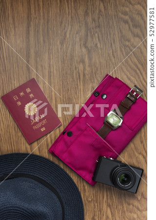 Passport and camera, watch, hat 52977581