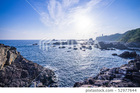 The southernmost tip of Honshu, the Shiono Cape lighthouse and the sun 52977644