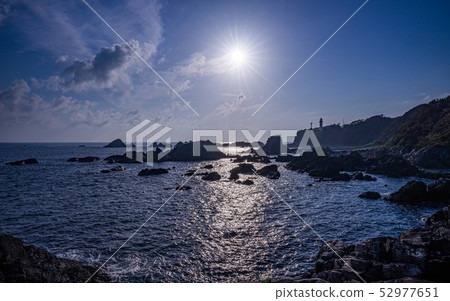 The southernmost tip of Honshu, the Shiono Cape lighthouse and the sun 52977651
