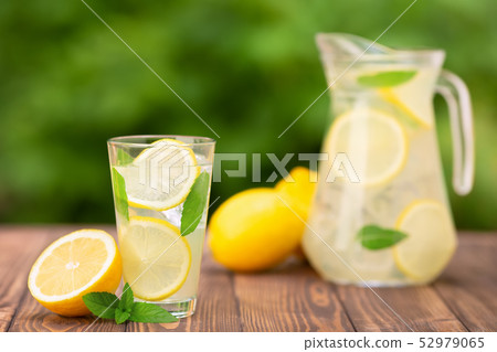 lemonade in glass and jug lemonade in glass and jug 52979065