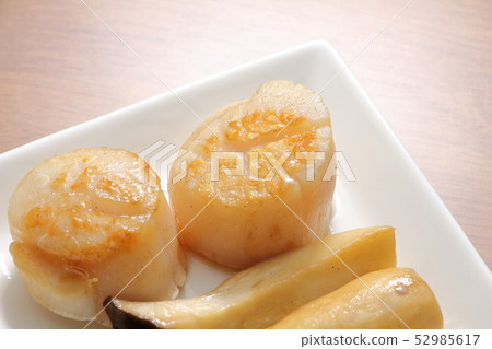 Butter grilled scallops. Eringhi to garnish. Butter grilled scallops. Eringhi to garnish. 52985617