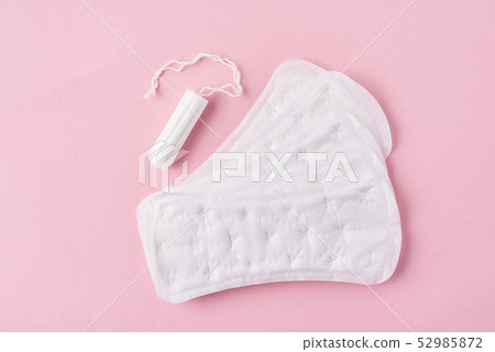 Sanitary pad and menstrual tampon on pink Sanitary pad and menstrual tampon on pink 52985872