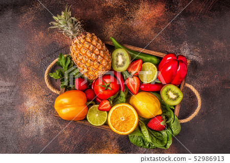 Fruits and vegetables rich in vitamin C in box. 52986913