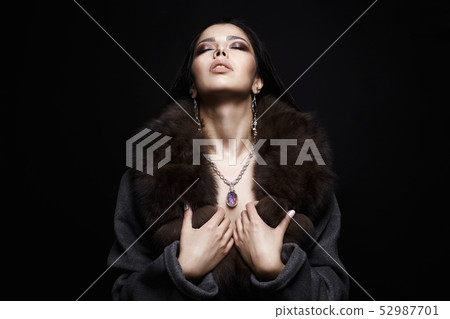 Beautiful Girl in Jewelry and Fur. Make-up and Beautiful Girl in Jewelry and Fur. Make-up and 52987701
