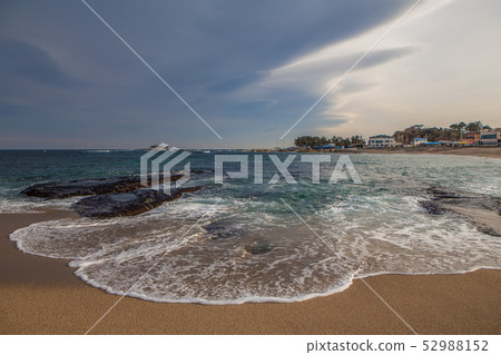 Winter beach with waves 52988152