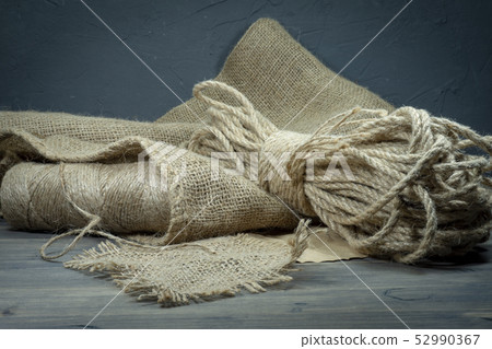 Jute twine, sackcloth fabric in close-up Jute twine, sackcloth fabric in close-up 52990367
