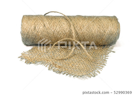 Jute fabric and spool of burlap threads Jute fabric and spool of burlap threads 52990369