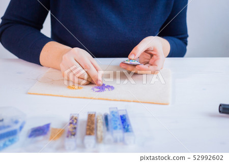 Designer making handmade brooch Designer making handmade brooch 52992602