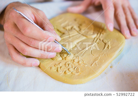 Potter making clay stamp picture Potter making clay stamp picture 52992722