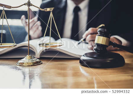 Professional Male lawyer or judge working with 52994332