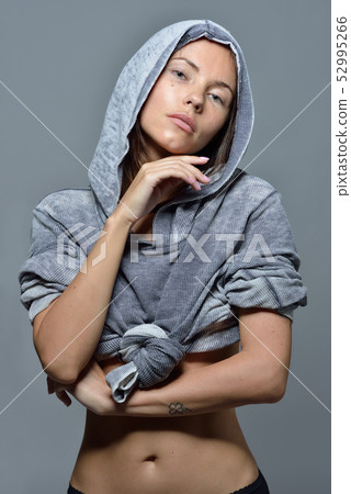 Portrait of the beautiful woman in grey hoody blouse. 52995266