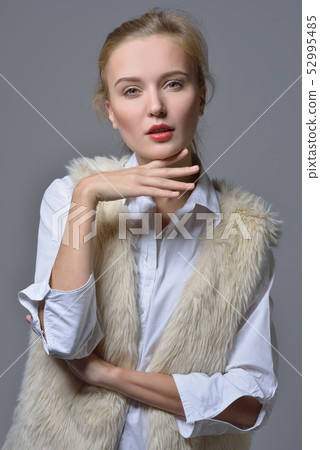 beautiful blonde woman in fur jacket. beautiful blonde woman in fur jacket. 52995485