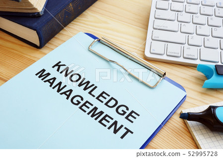 Knowledge management concept. Clipboard and books Knowledge management concept. Clipboard and books 52995728