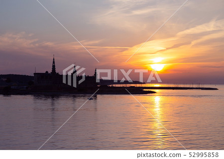 Kronborg castle silhouette in Helsingor at sunset Kronborg castle silhouette in Helsingor at sunset 52995858