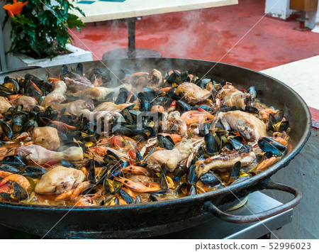 Close up image of paella with seafood and chicken. Close up image of paella with seafood and chicken. 52996023