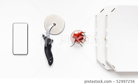Phone, Cutter, Bowl With Chilli Peppers And Delivery Boxes 52997256