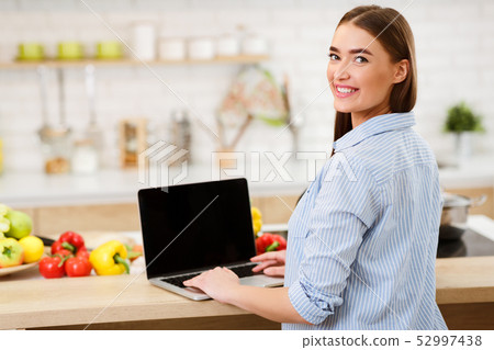 Cooking Blog. Woman Searching Recipes Online On Laptop Cooking Blog. Woman Searching Recipes Online On Laptop 52997438