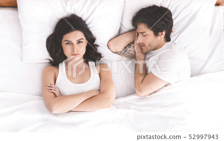 Young couple in bed having problems and crisis 52997943