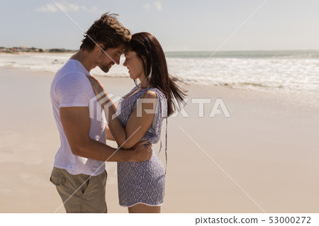 Romantic happy young couple head to head on beach Romantic happy young couple head to head on beach 53000272