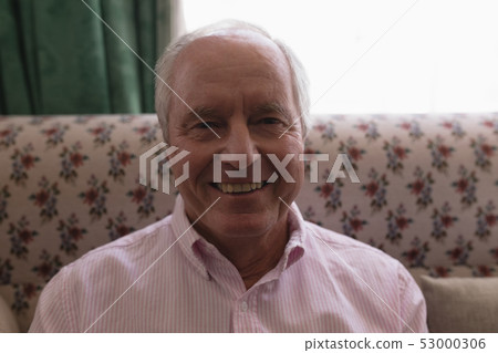 Senior man relaxing in living room at home Senior man relaxing in living room at home 53000306