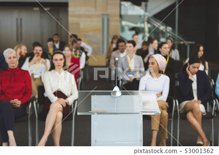 Group of business people attending a business seminar Group of business people attending a business seminar 53001362