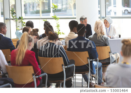 Group of business people attending a business seminar 53001464