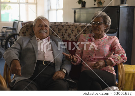 Front view of senior couple interacting with each other at home Front view of senior couple interacting with each other at home 53001652