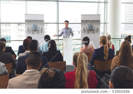 Businessman speaks to group at a business seminar 53002686