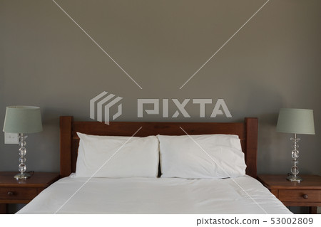 Table lamp in bedroom at home 53002809