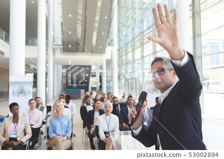 Male speaker speaks in a business seminar Male speaker speaks in a business seminar 53002894