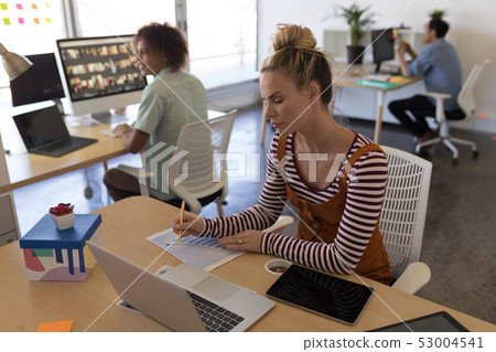 Female executive working at desk Female executive working at desk 53004541