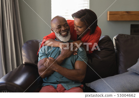 Senior couple having fun in living room Senior couple having fun in living room 53004662
