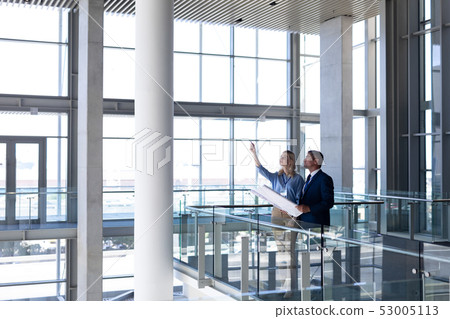 Caucasians architects discussing interacting with each other in office Caucasians architects discussing interacting with each other in office 53005113