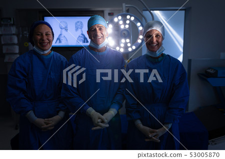 Surgeons standing in operation theater Surgeons standing in operation theater 53005870
