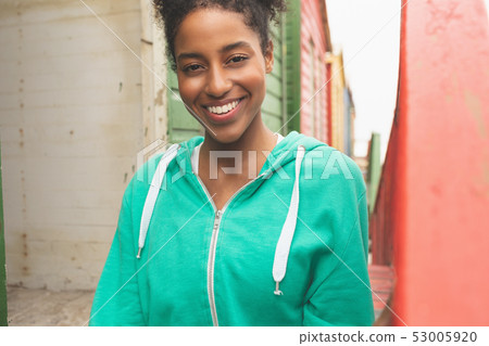 Beautiful woman sitting at beach hut Beautiful woman sitting at beach hut 53005920
