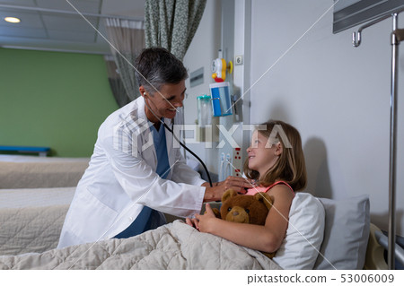 Doctor examining girl patient in clinic at hospital 53006009