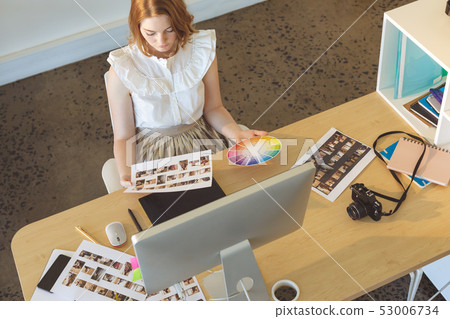 Female graphic designer working at desk in office 53006734