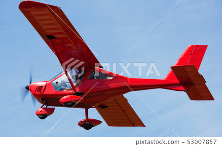 Image of sports plane flying rapidly in the sky, outdoor Image of sports plane flying rapidly in the sky, outdoor 53007857