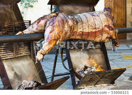 Whole bull carcass on spit Whole bull carcass on spit 53008321