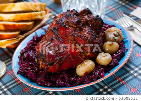 Roasted pork knuckle with braised cabbage Roasted pork knuckle with braised cabbage 53008513