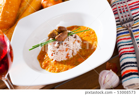 Chicken hearts with rice, tomato cream sauce, rose wine Chicken hearts with rice, tomato cream sauce, rose wine 53008573