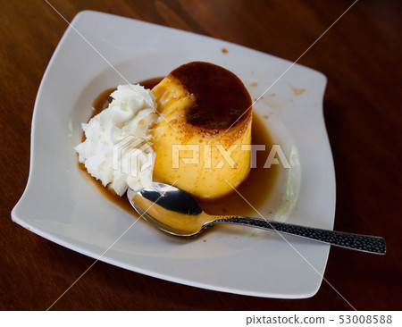 Custard flan with whipped cream Custard flan with whipped cream 53008588