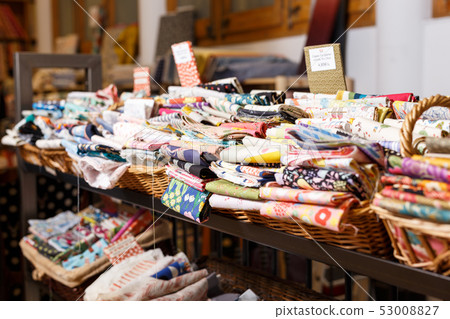 Cloth rolls on store shelves Cloth rolls on store shelves 53008827
