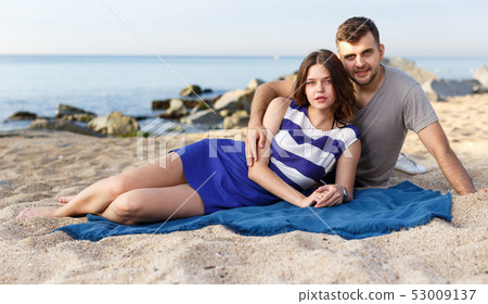 Young loving couple resting and hugging Young loving couple resting and hugging 53009137