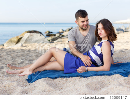Young loving couple resting and hugging Young loving couple resting and hugging 53009147
