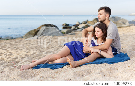 Happy loving couple resting and hugging Happy loving couple resting and hugging 53009278