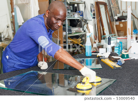 Adult African American glazier during daily work 53009540